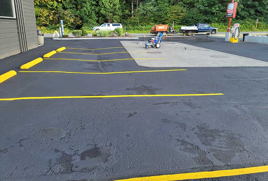 parking lot in need of asphalt repair bellingham