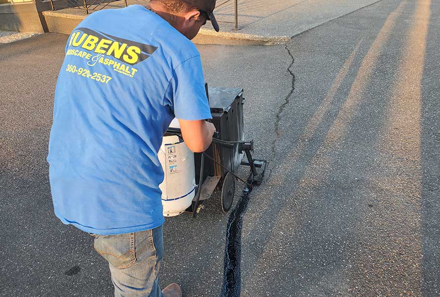 man doing an asphalt repair bellingham